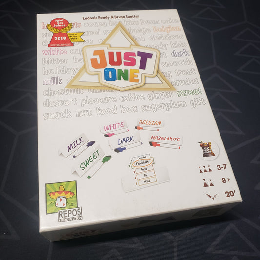 Image shows the front cover of the box for the Just One party game