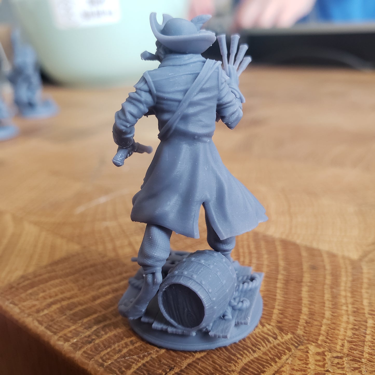 Image is a photo of a 3D printed catfolk pirate gaming miniature printed in-house at All Systems Go