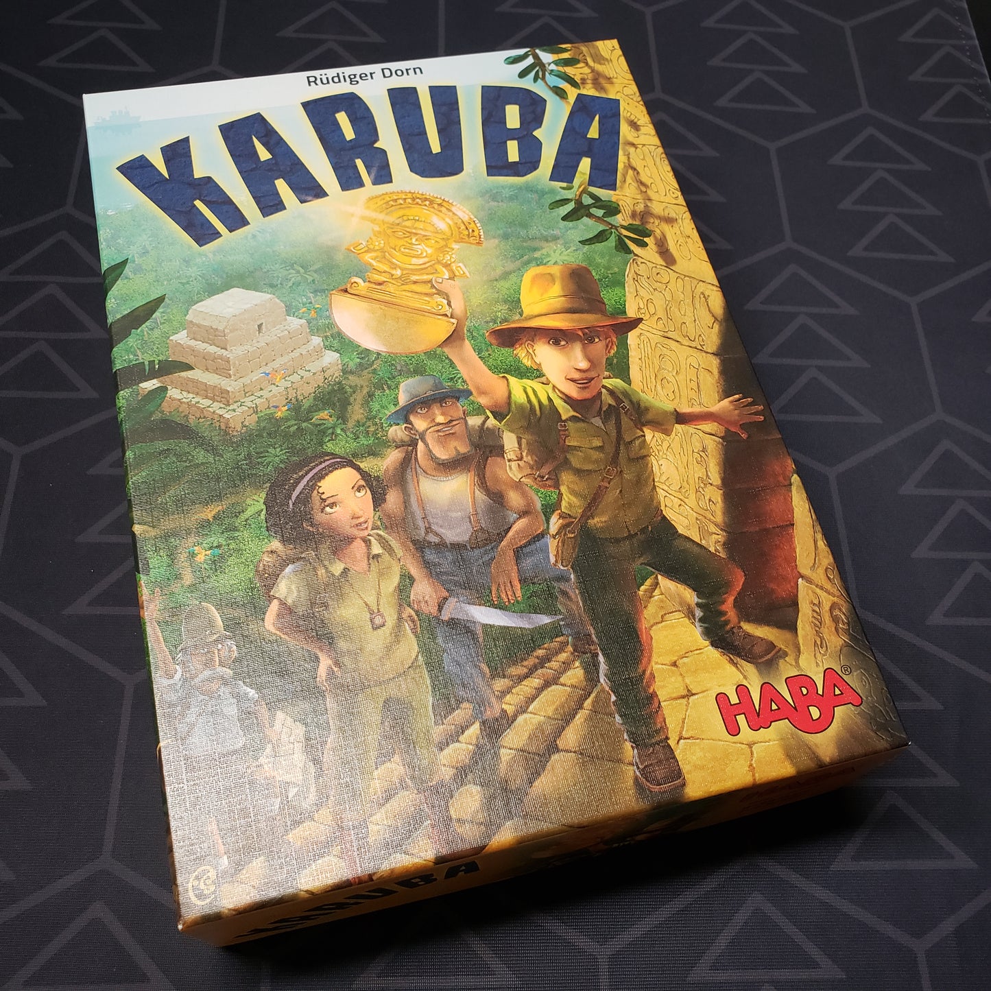 Image shows the front cover of the box of the Karuba board game