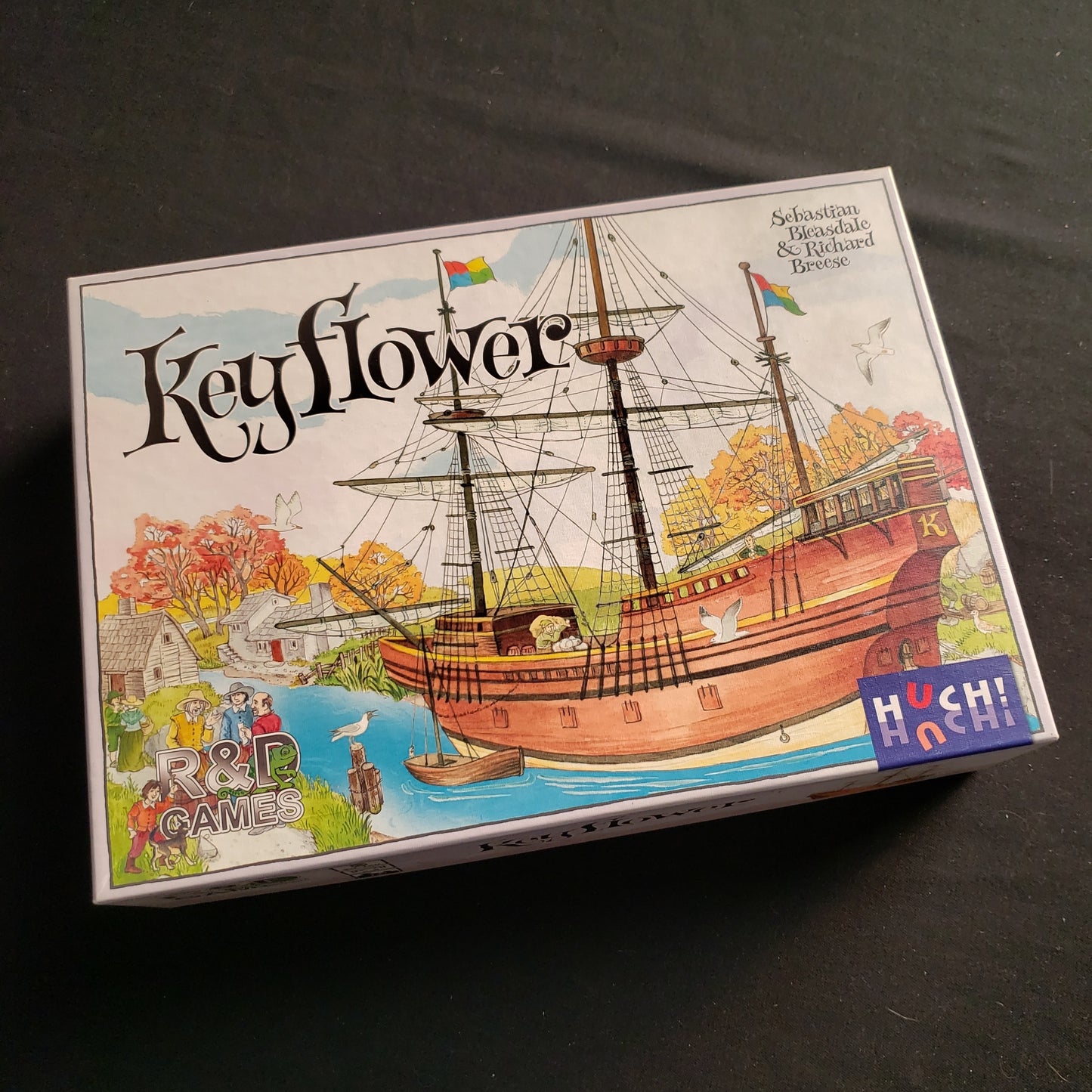 Image shows the front cover of the box of the Keyflower board game