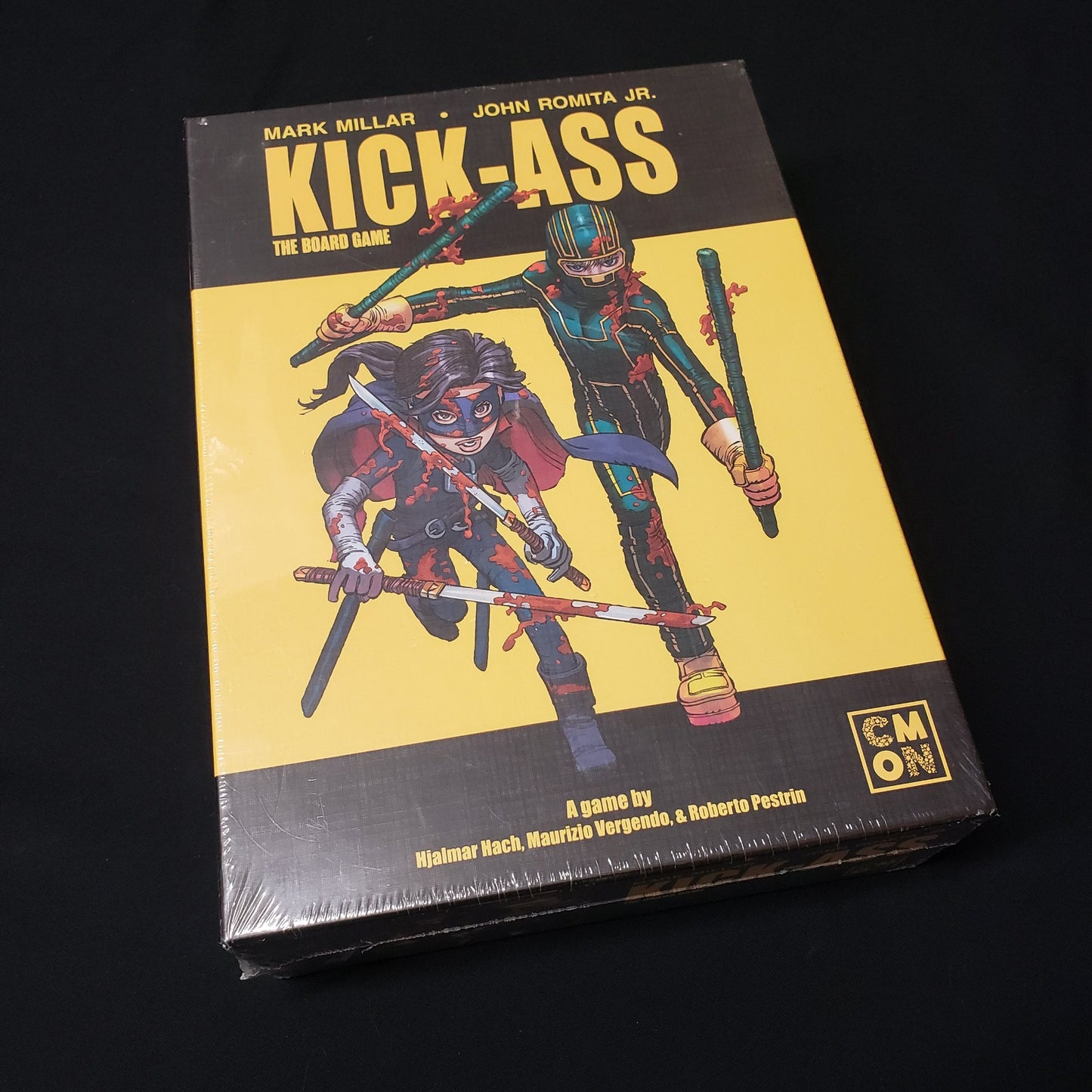 Image shows the front cover of the box of Kick-Ass: The Board Game