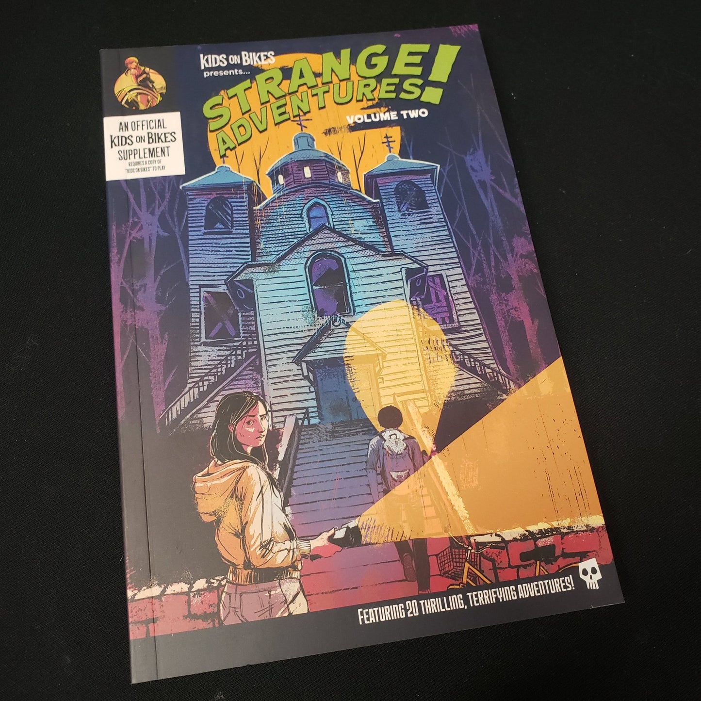 Image shows the front cover of the Strange Adventures! Vol. 2 book for the roleplaying game Kids on Bikes