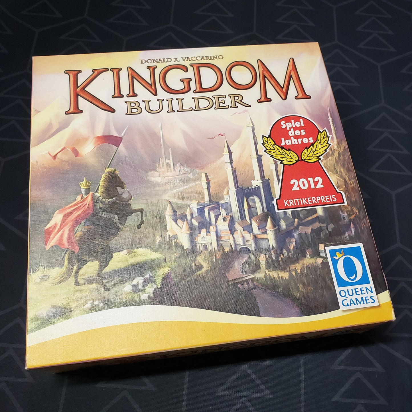 Image shows the front cover of the box of the Kingdom Builder board game