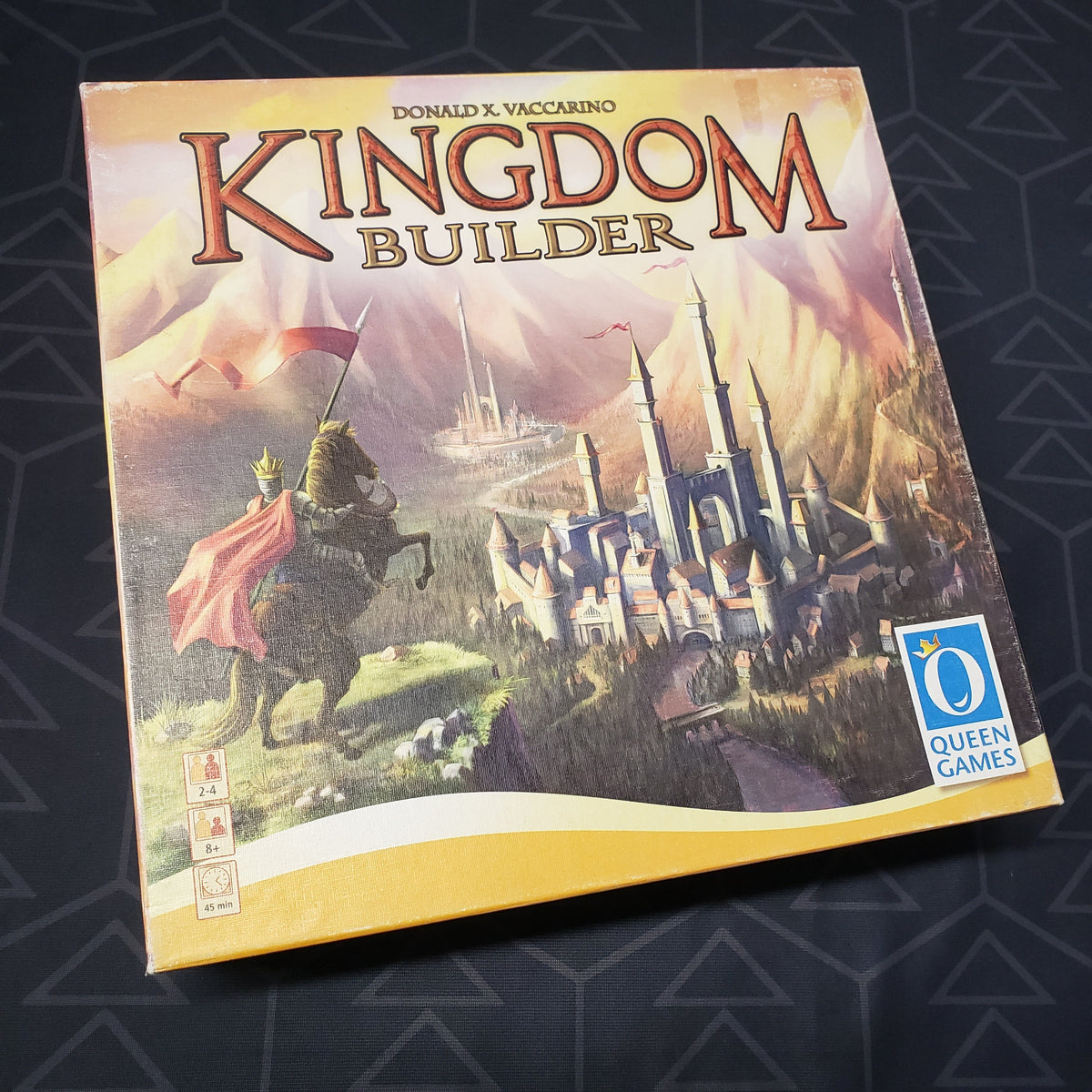 Image shows the front cover of the box of the Kingdom Builder board game