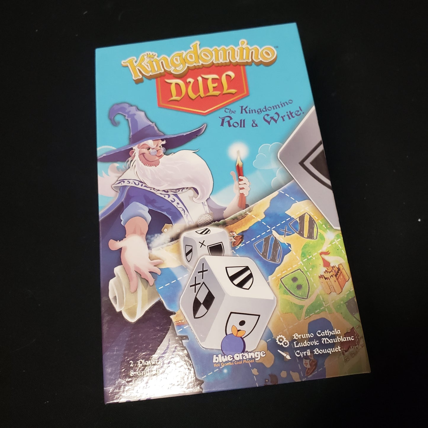 Image shows the front cover of the box of the Kingdomino Duel board game