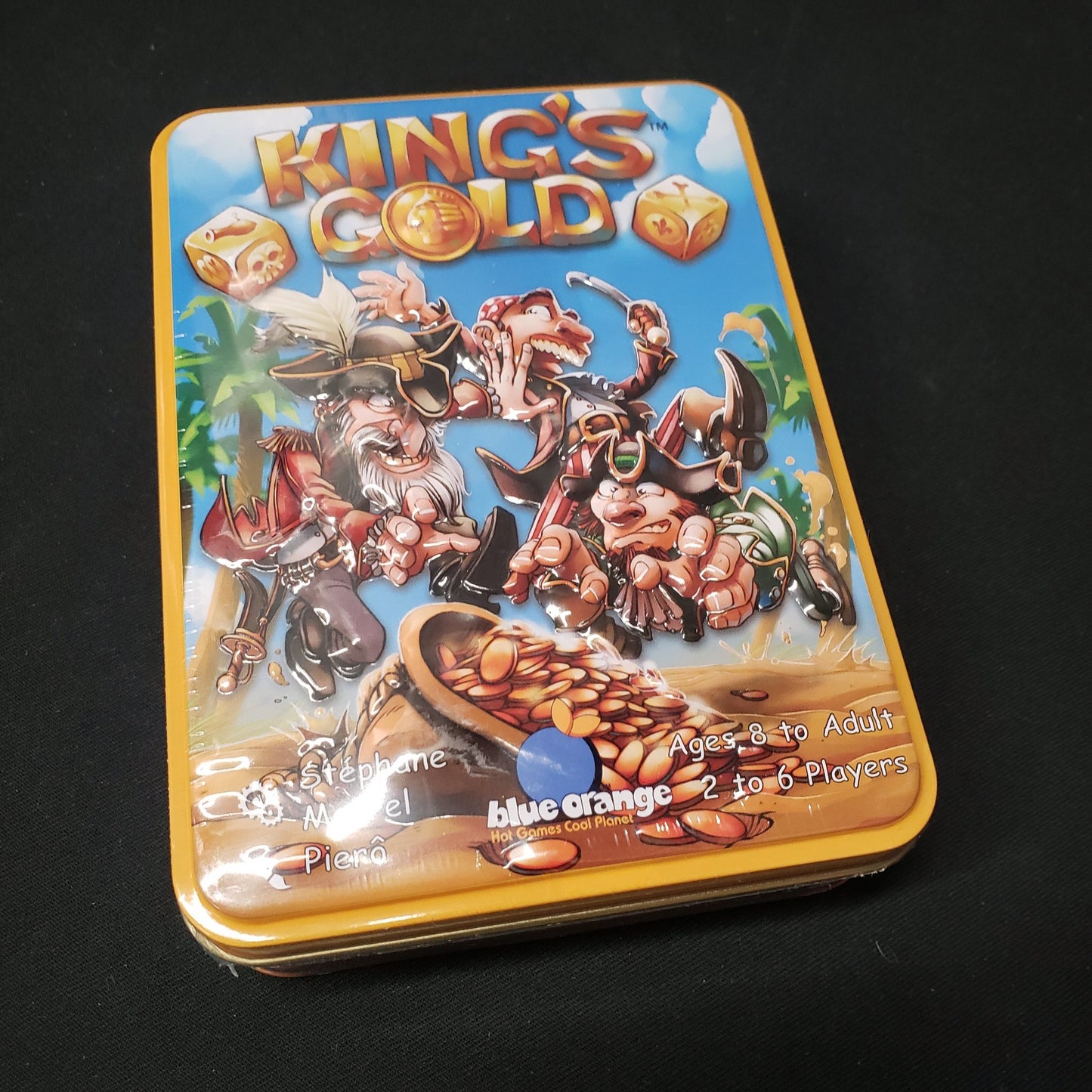 Image shows the front cover of the box of the King's Gold dice game