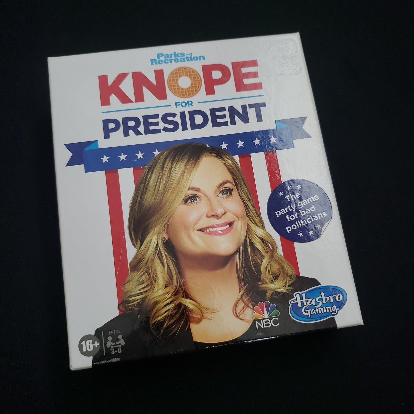 Image shows the front cover of the box of the Knope for President card game