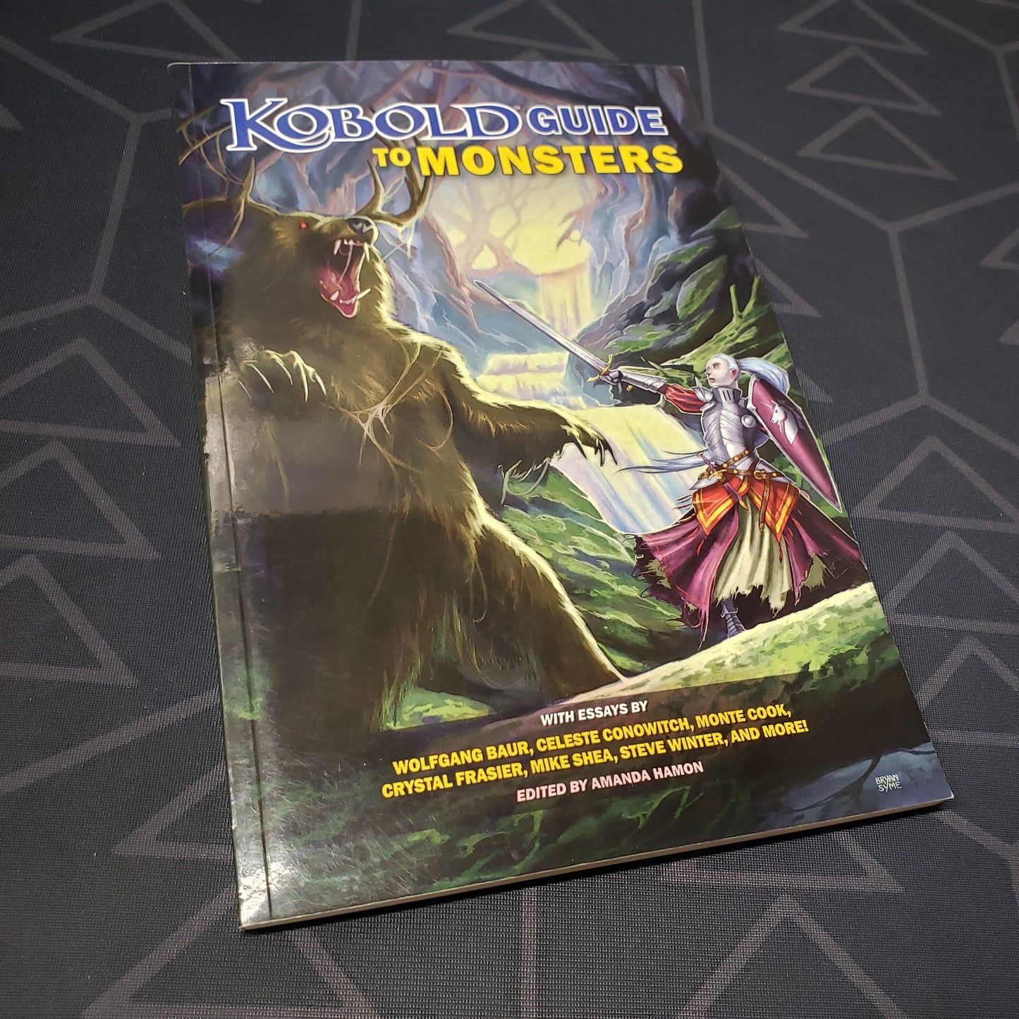 Image shows the front cover of the Kobold Guide to Monsters roleplaying game book