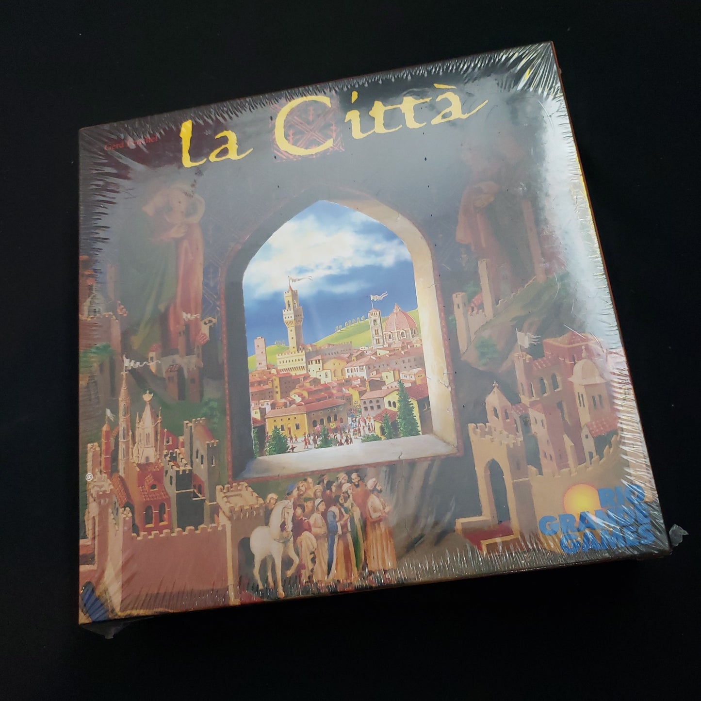 Image shows the front cover of the box of the La Citta board game