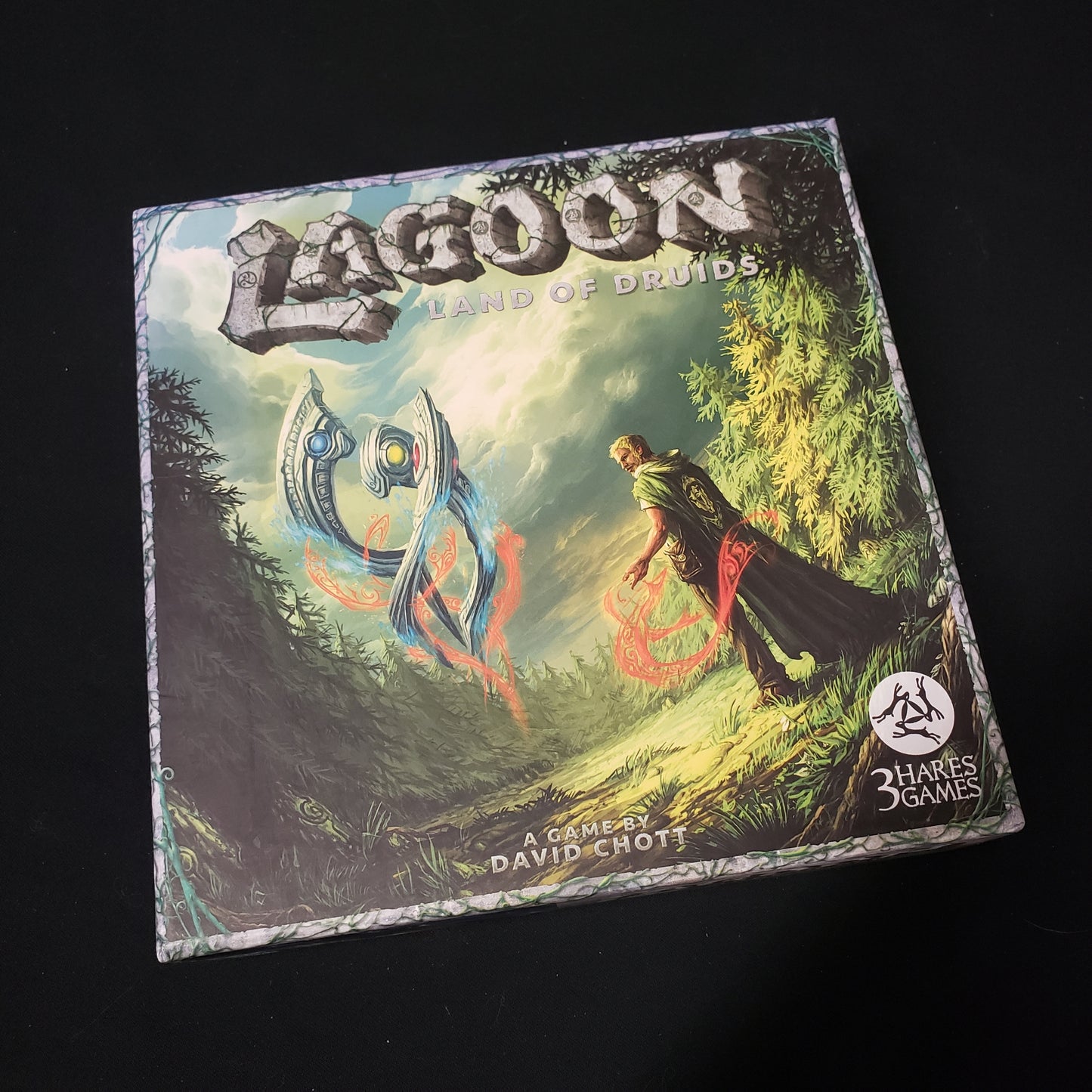 Image shows the front cover of the box of the Lagoon: Land of Druids board game