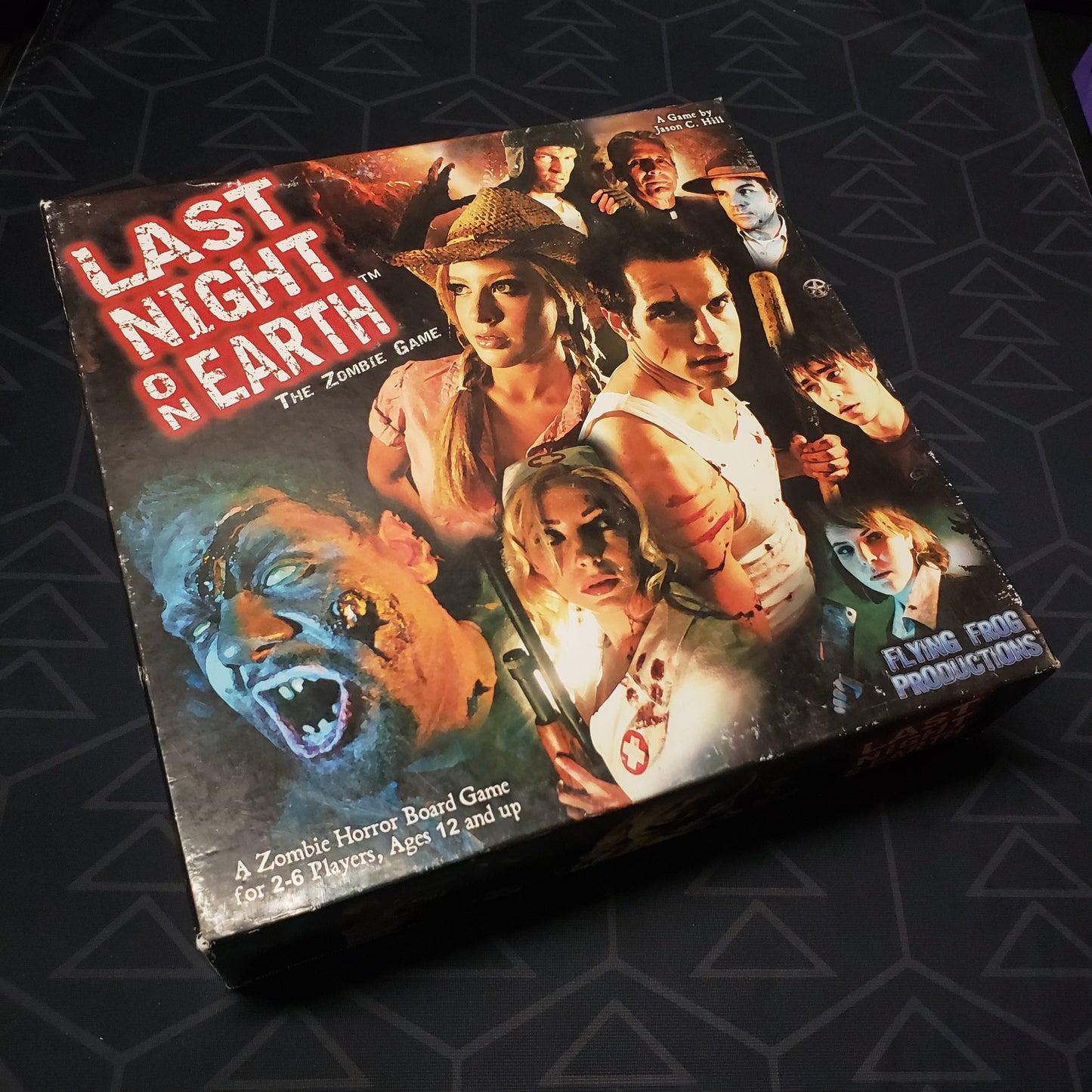 Image shows the front cover of the box of the Last Night on Earth board game