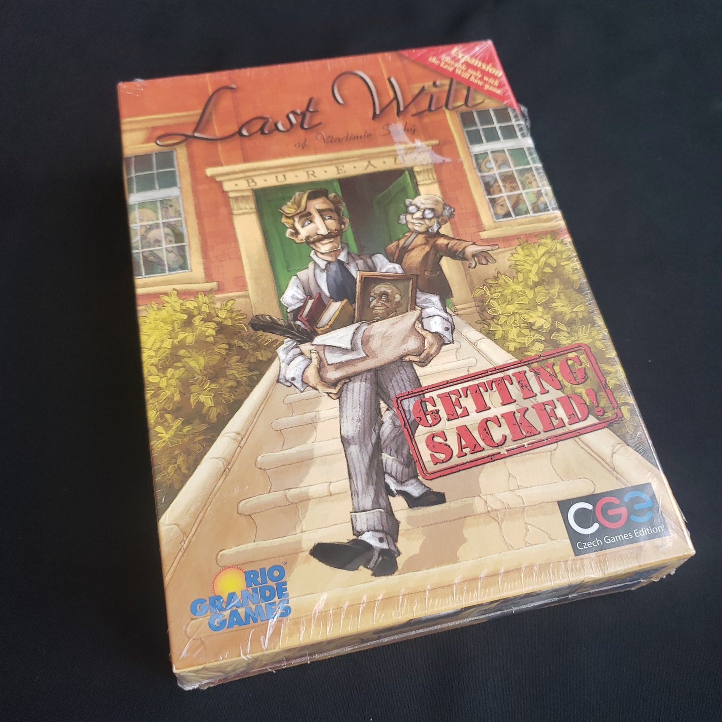 Image shows the front cover of the box of the Getting Sacked expansion for the board game Last Will