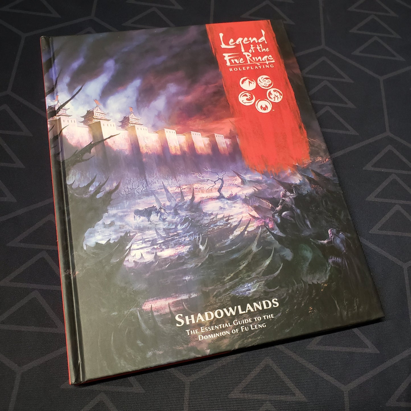Image shows the front cover of the Shadowlands book for the roleplaying game Legend of the Five Rings: Fifth Edition
