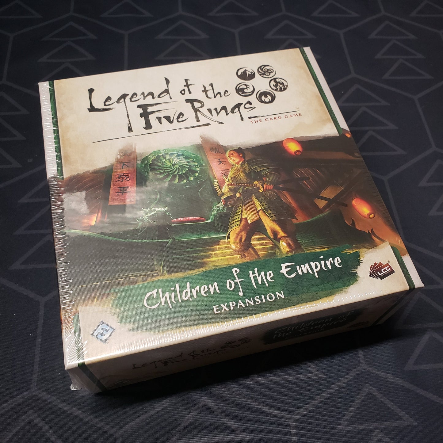 Image shows the front of the package of the Children of the Empire pack for the card game Legend of the Five Rings