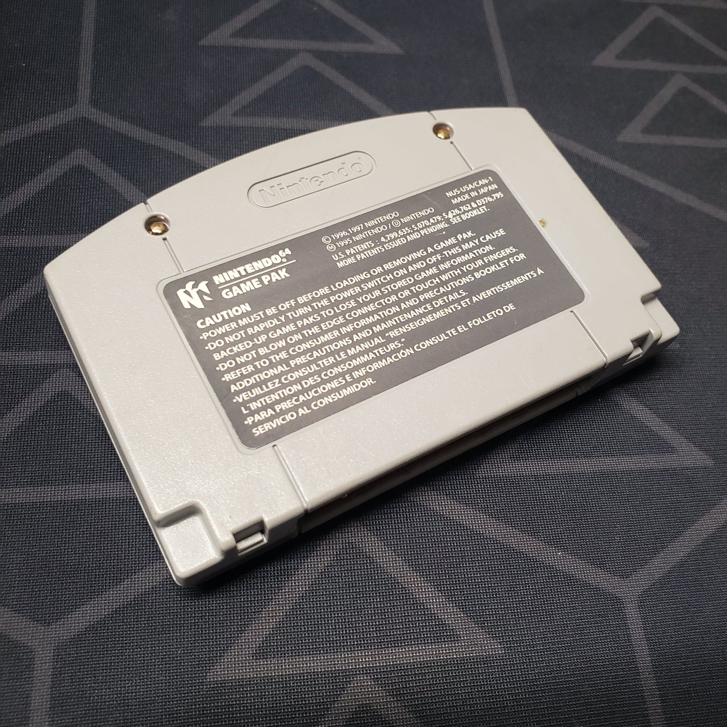 Image shows the back of the cartridge for the video game Legend of Zelda: Ocarina of Time for the Nintendo 64