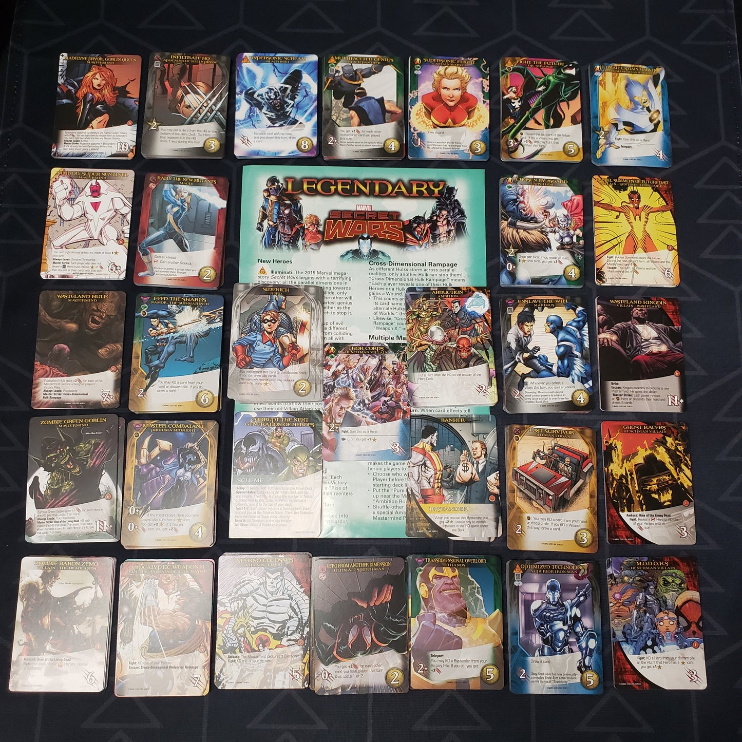 Image shows the instructions & cards arranged in stacks by card type for the Secret Wars Volume 1 expansion for the card game Legendary Marvel