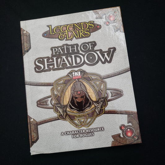 Image shows the front cover of the Legends & Lairs: Path of Shadow roleplaying game book