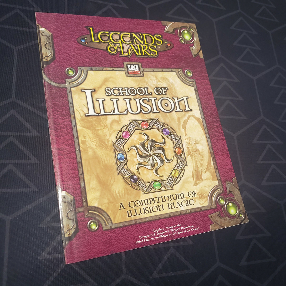 Image shows the front cover of the Legends & Lairs: School of Illusion roleplaying game book