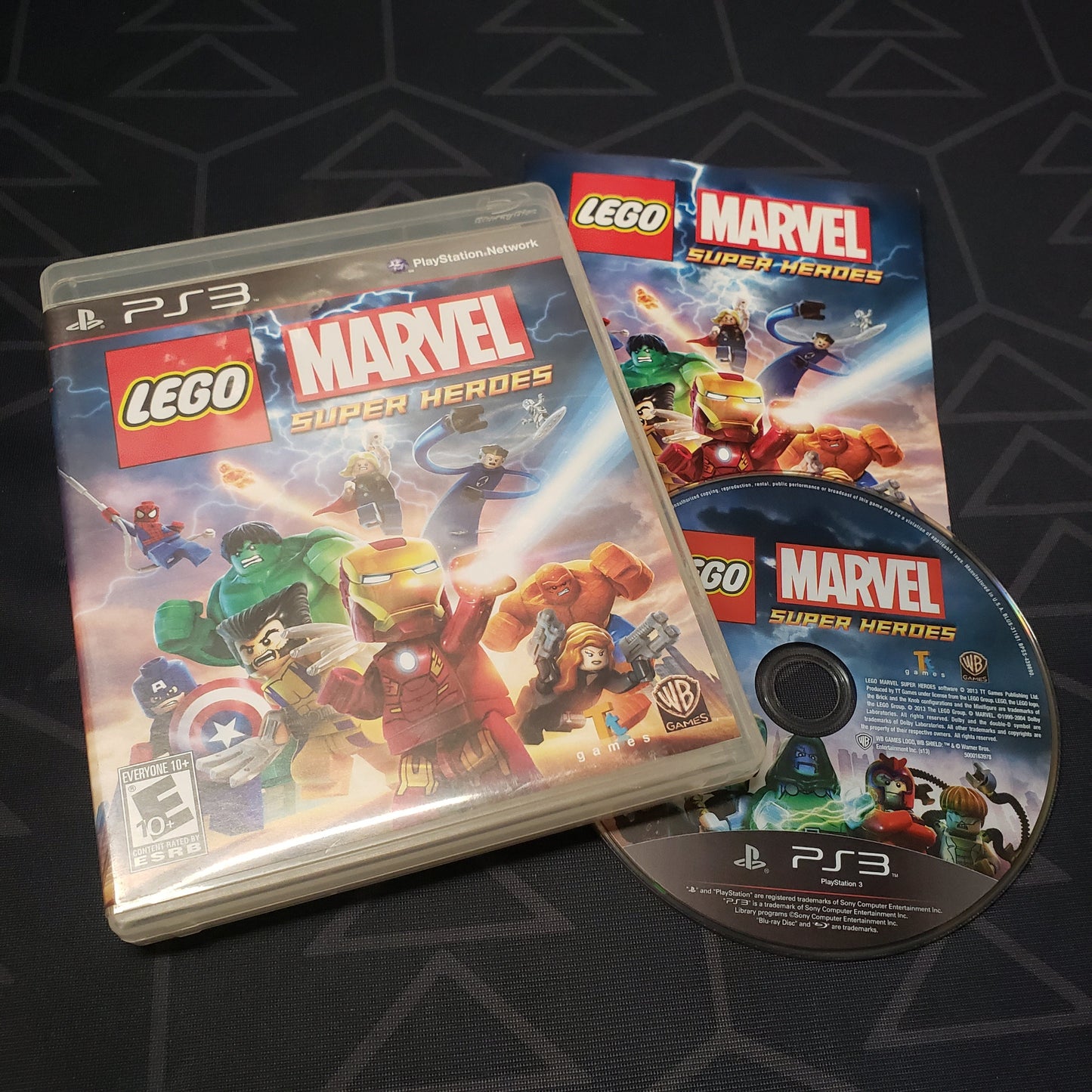 Image shows the case, manual and disc for the video game LEGO Marvel Super Heroes for Playstation 3