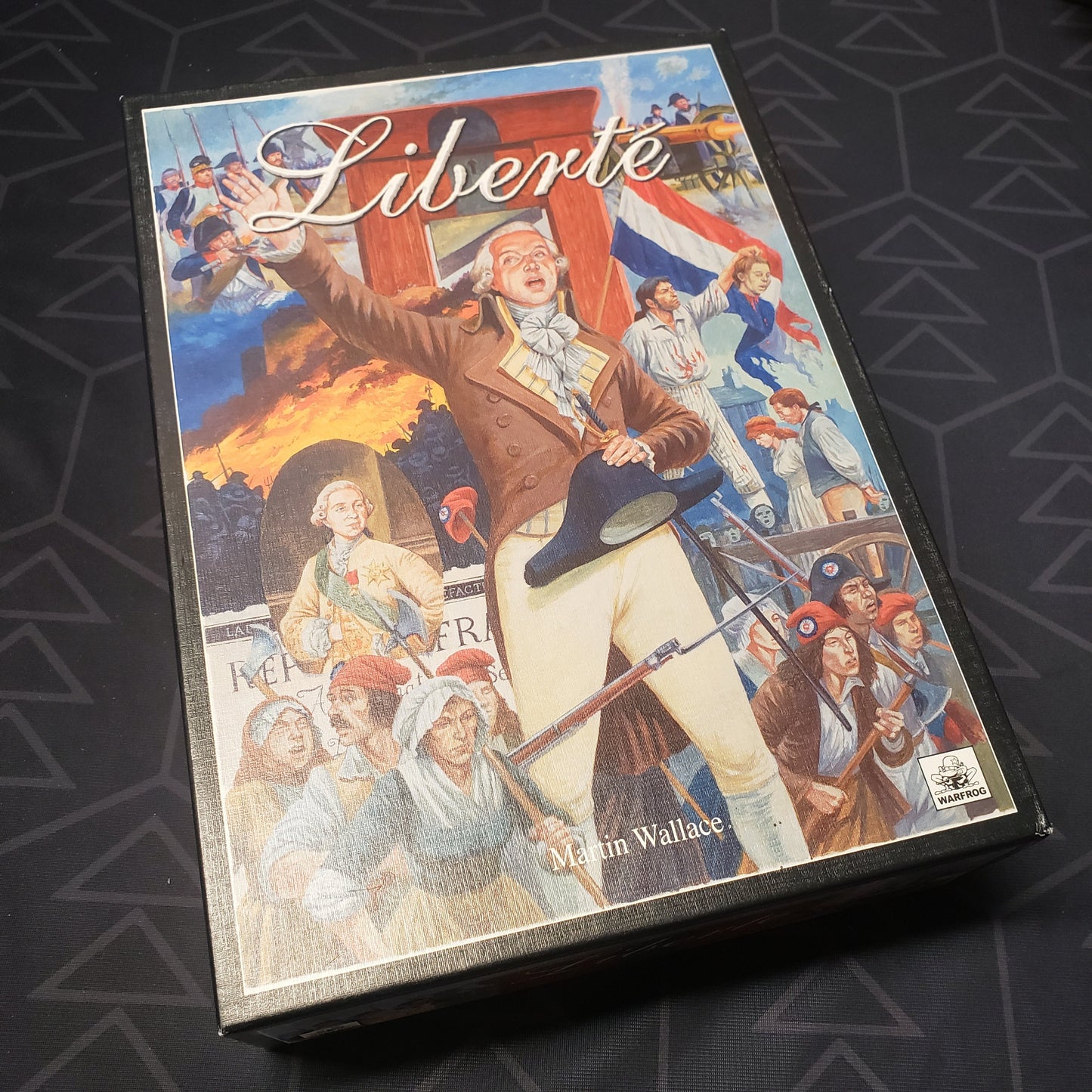 Image shows the front cover of the box of the Liberte board game
