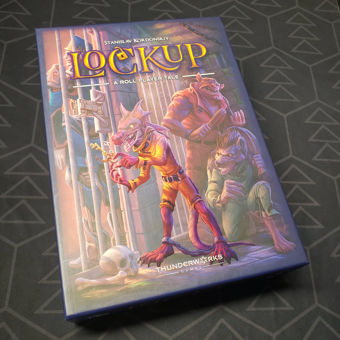 Image shows the front cover of the box for the Lockup: A Roll Player Tale board game