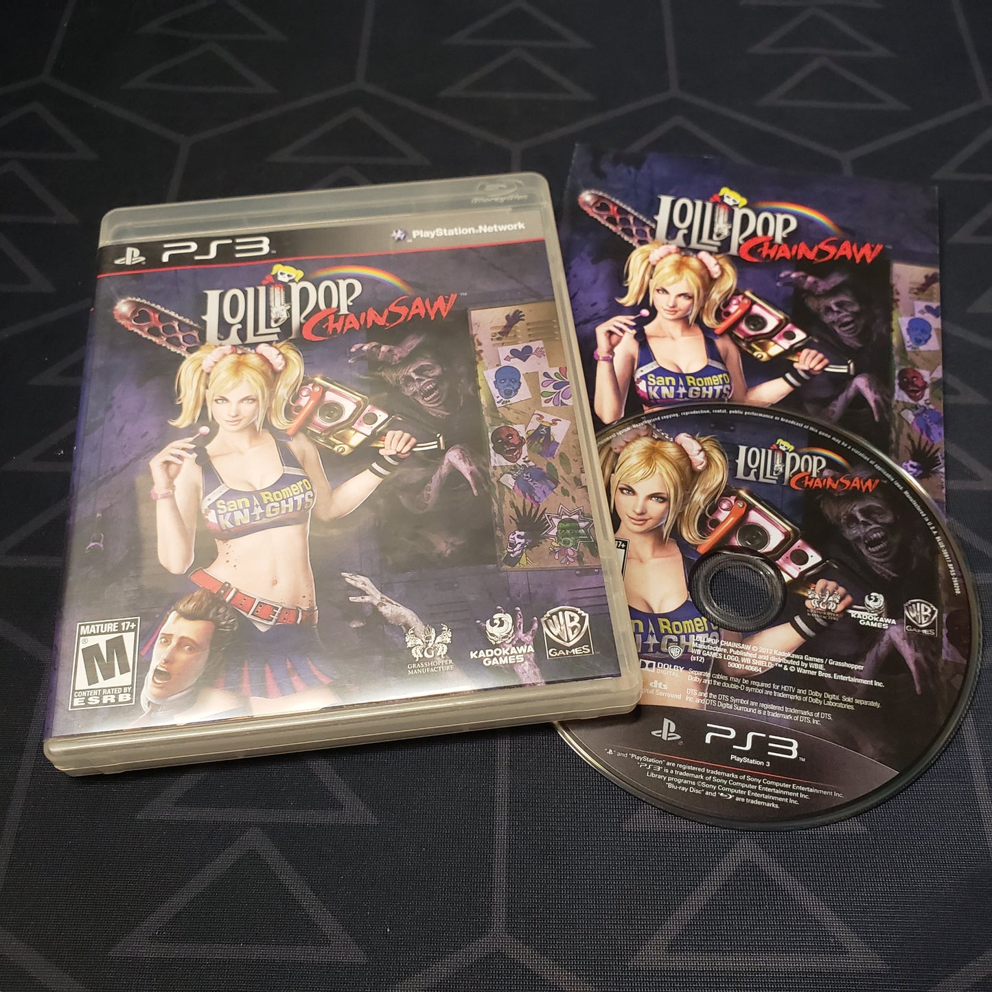 Image shows the case, manual and disc for the video game Lollipop Chainsaw for Playstation 3