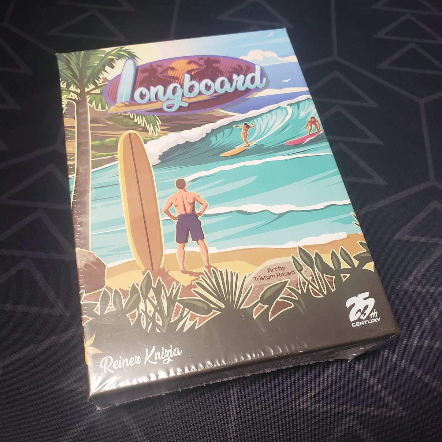 Image shows the front cover of the box of the Longboard card game
