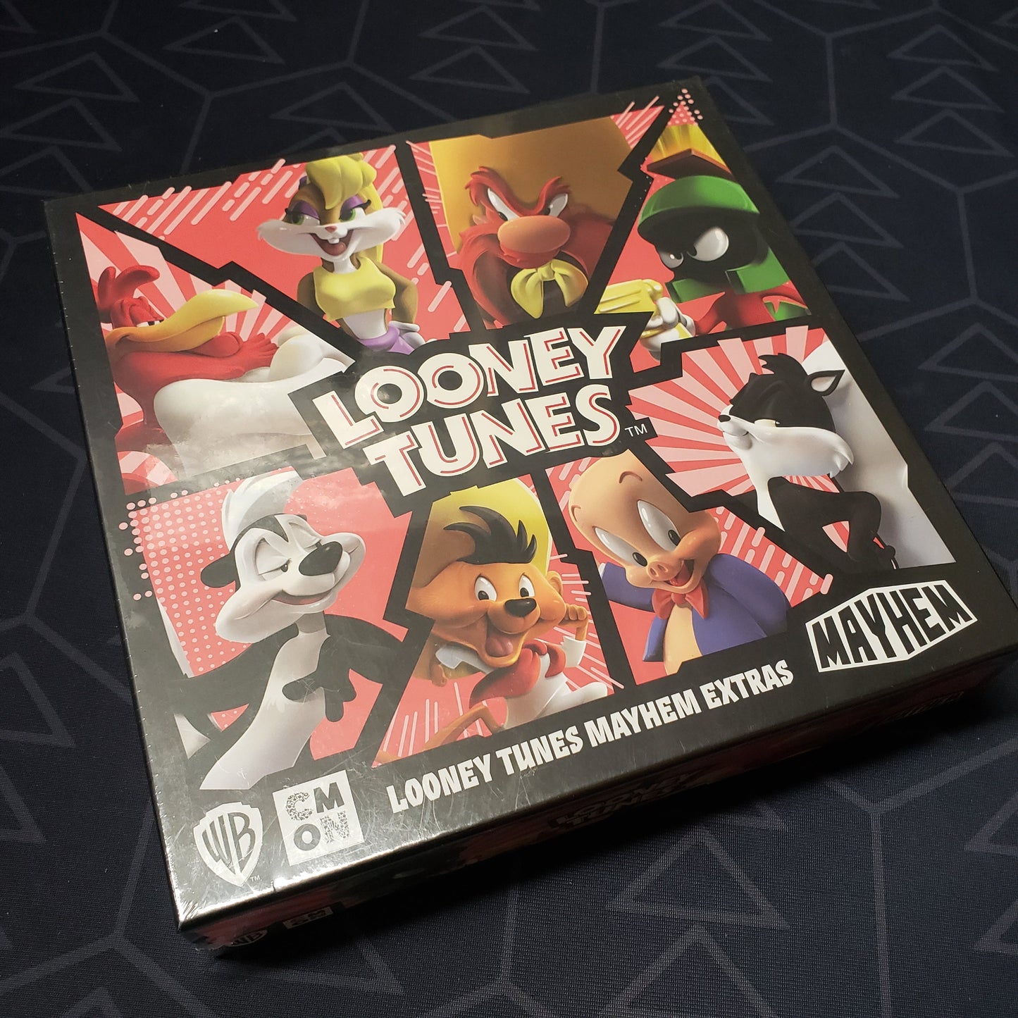 Image shows the front cover of the Extras Box for the board game Looney Tunes Mayhem