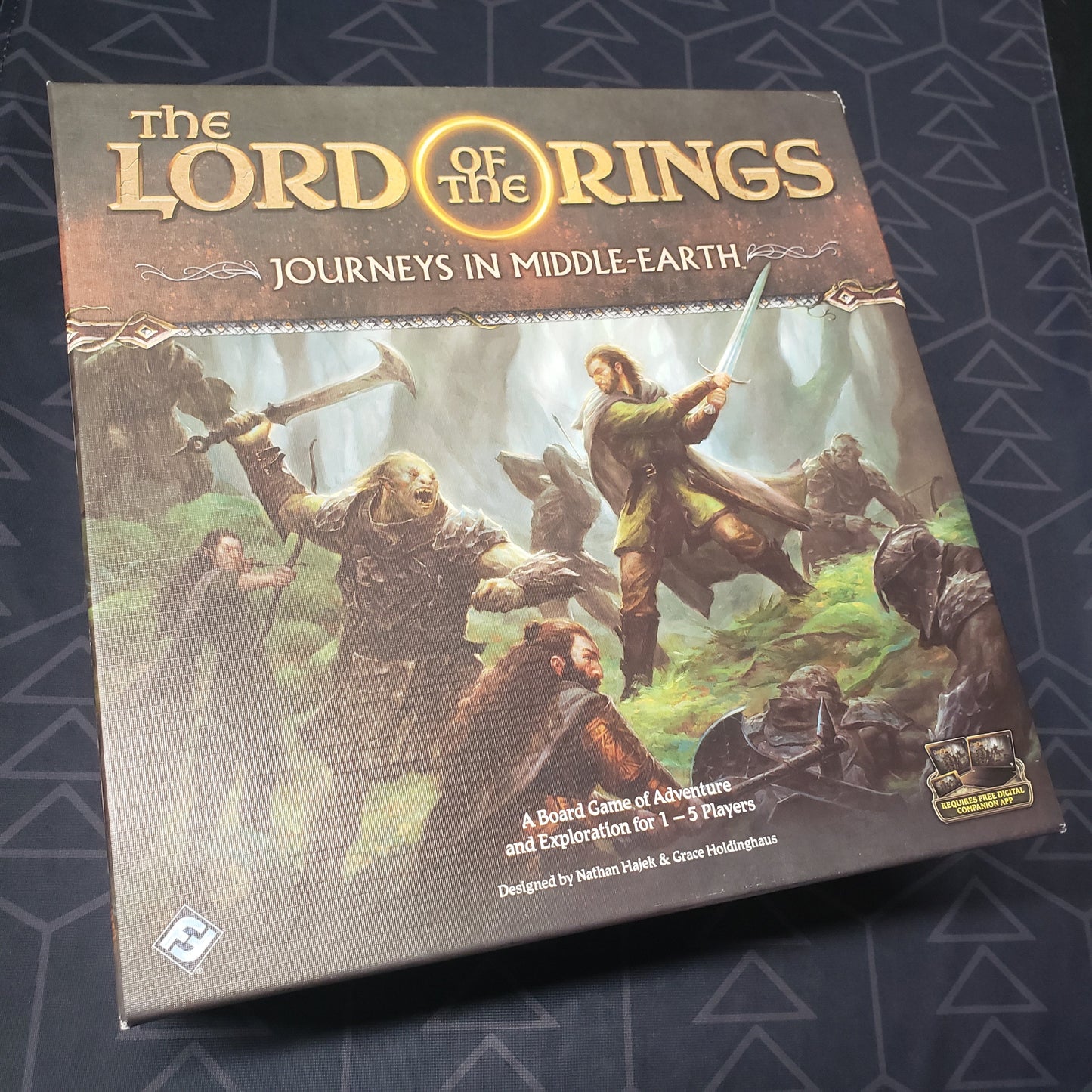 Image shows the front cover of the box of the Lord of the Rings: Journeys in Middle-Earth board game