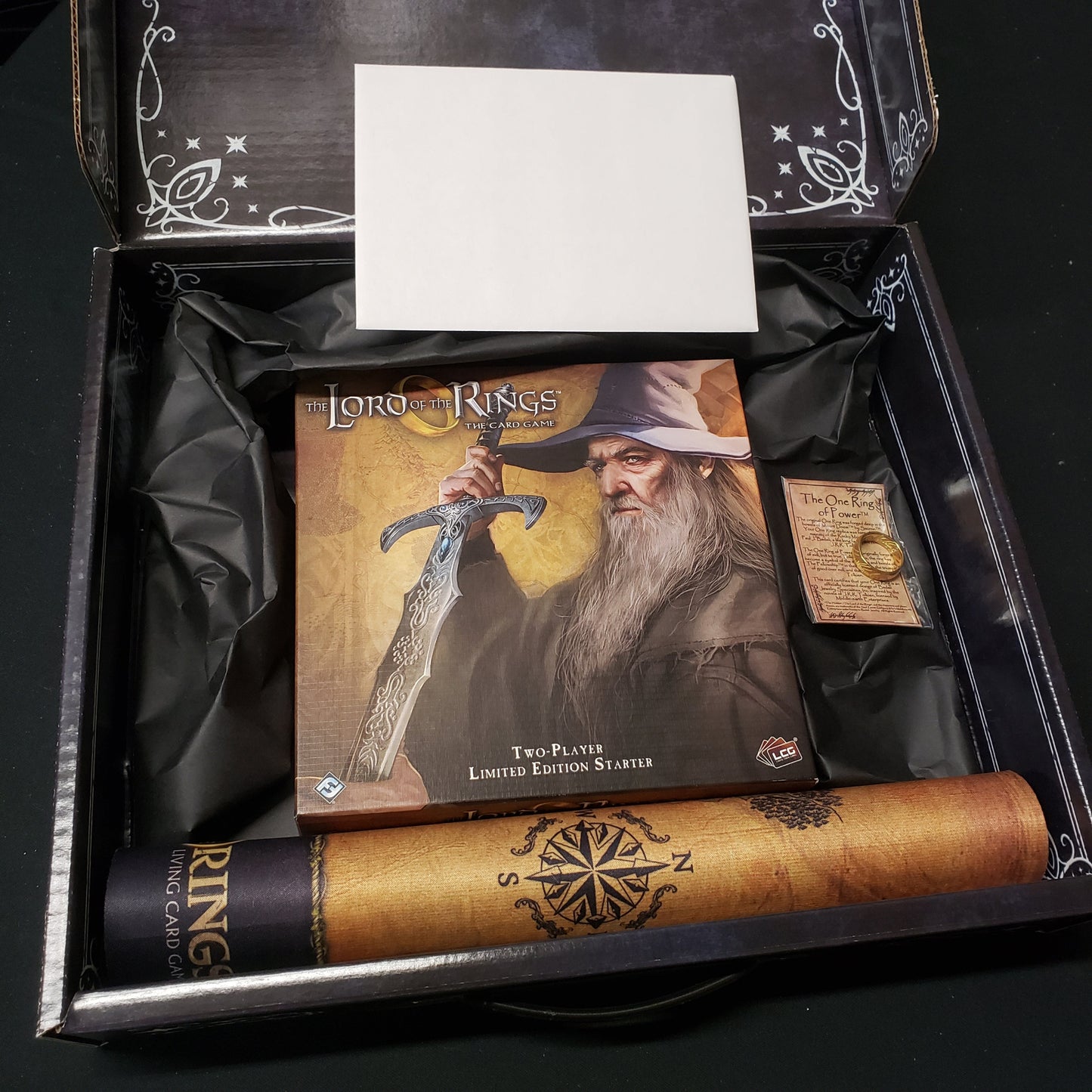 Image shows the contents of the Collector's / Limited Edition Two-Player Starter Set for the card game Lord of the Rings in the box