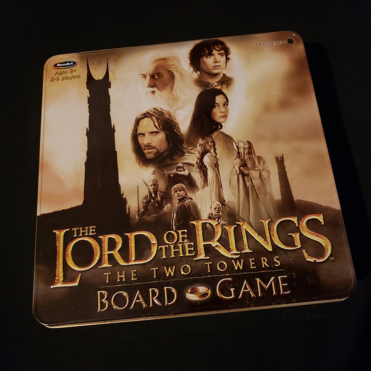 Image shows the front cover of the box of the Lord of the Rings: Two Towers board game