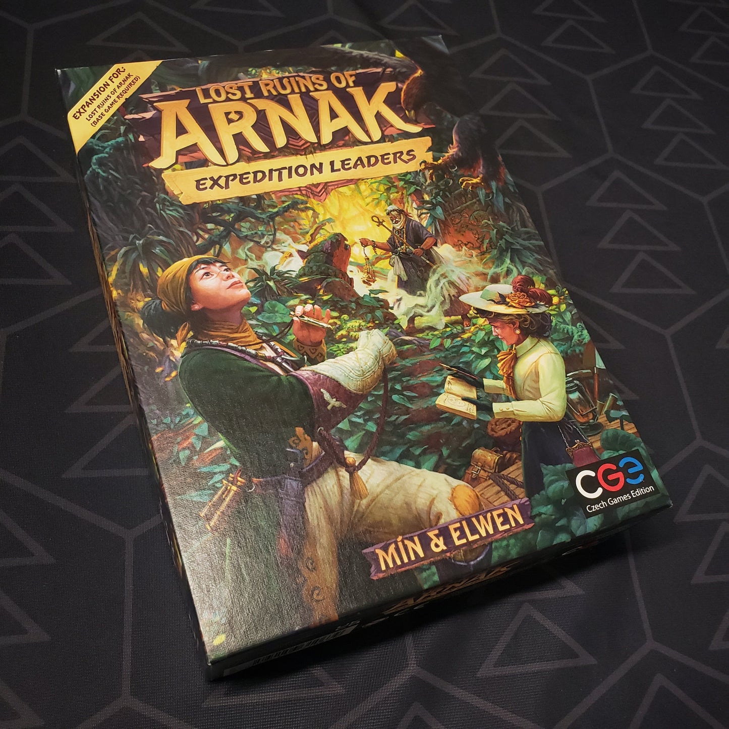 Image shows the front cover of the box of the Expedition Leaders expansion for the board game Lost Ruins of Arnak