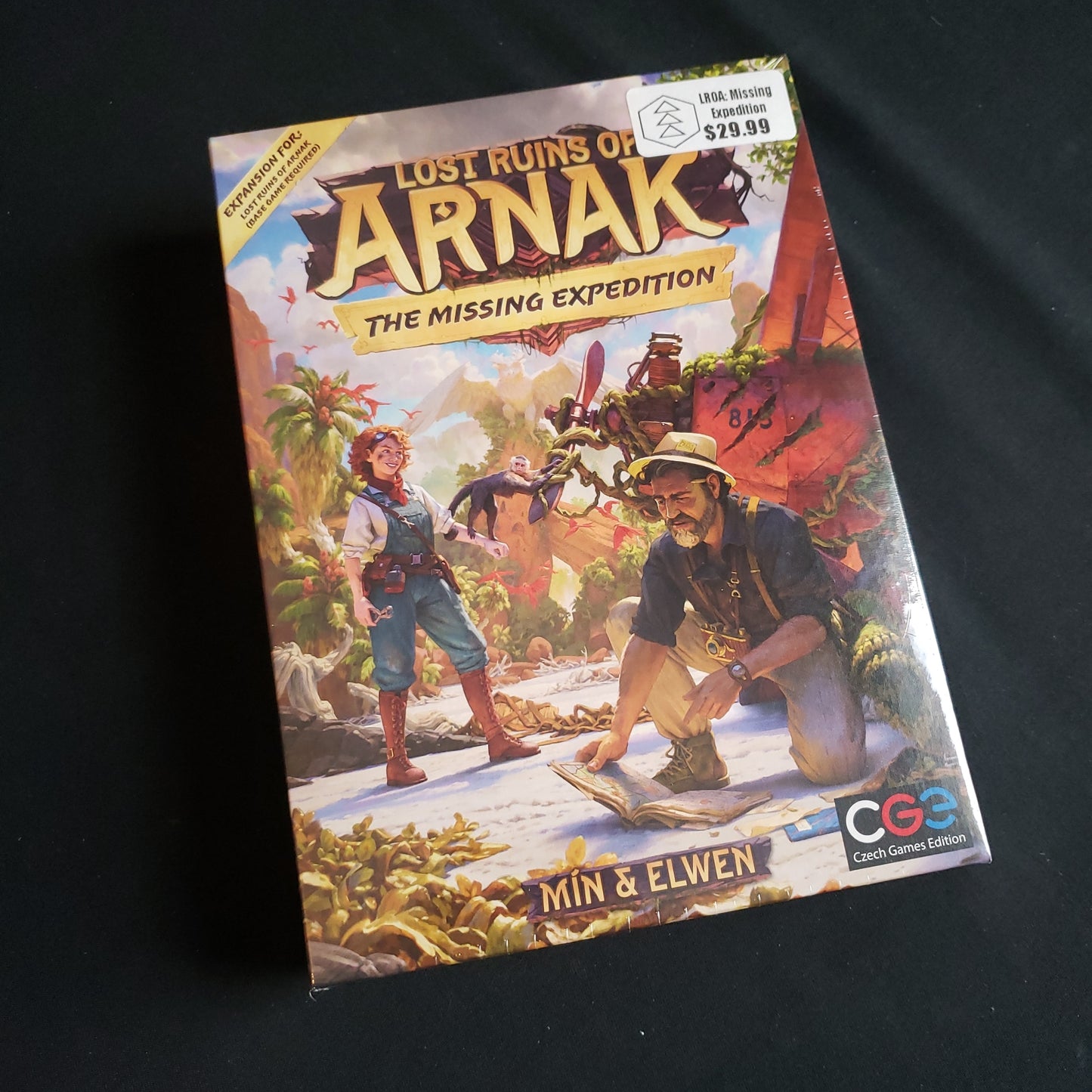 Image shows the front cover of the box of the Missing Expedition expansion for the board game Lost Ruins of Arnak