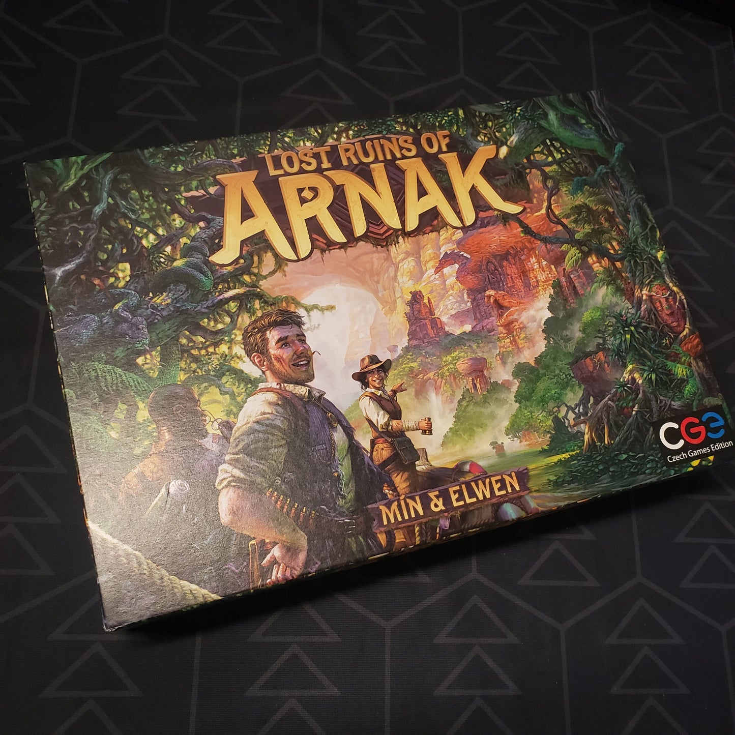 Image shows the front cover of the box of the Lost Ruins of Arnak board game