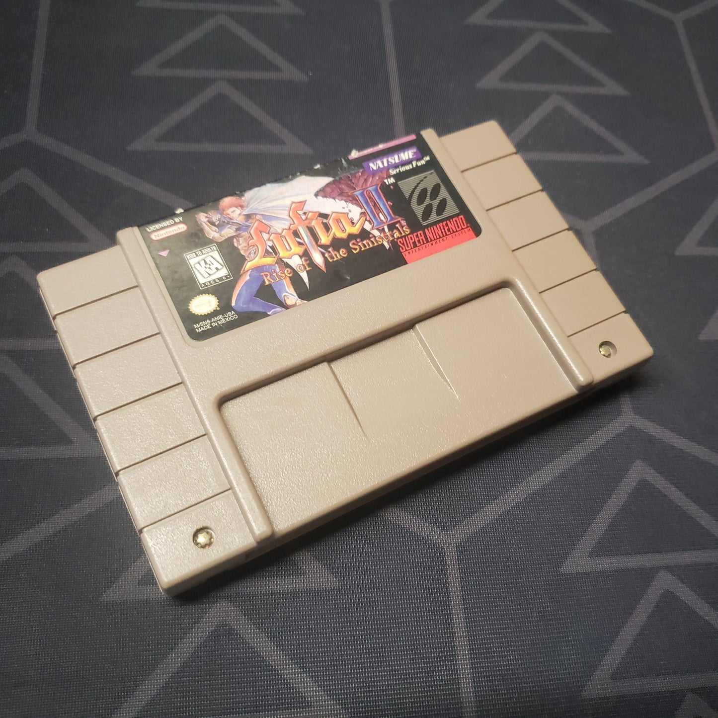 Image shows the front of the cartridge for the video game Lufia II: Rise of the Sinistrals for the Super Nintendo