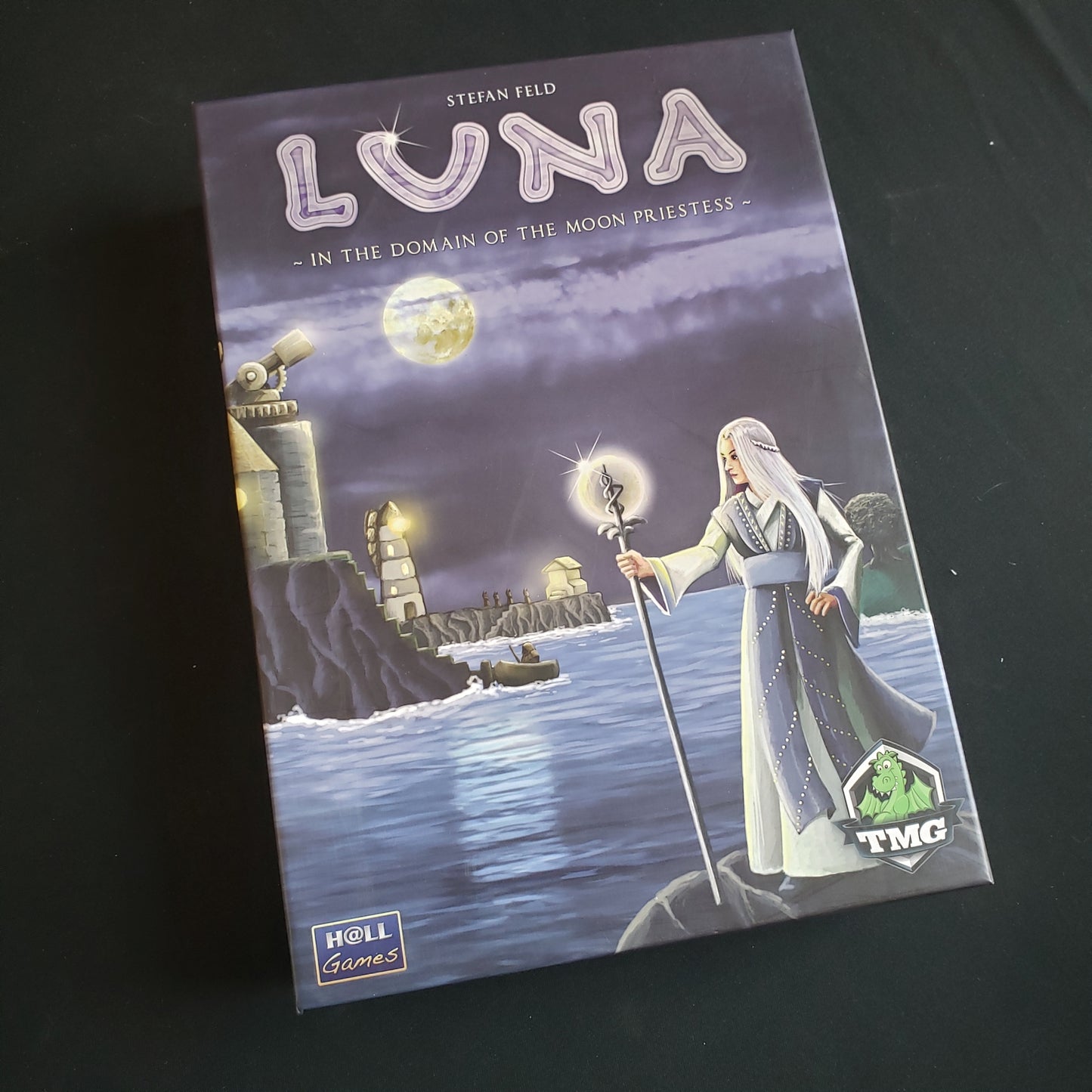 Image shows the front cover of the box of the board game Luna
