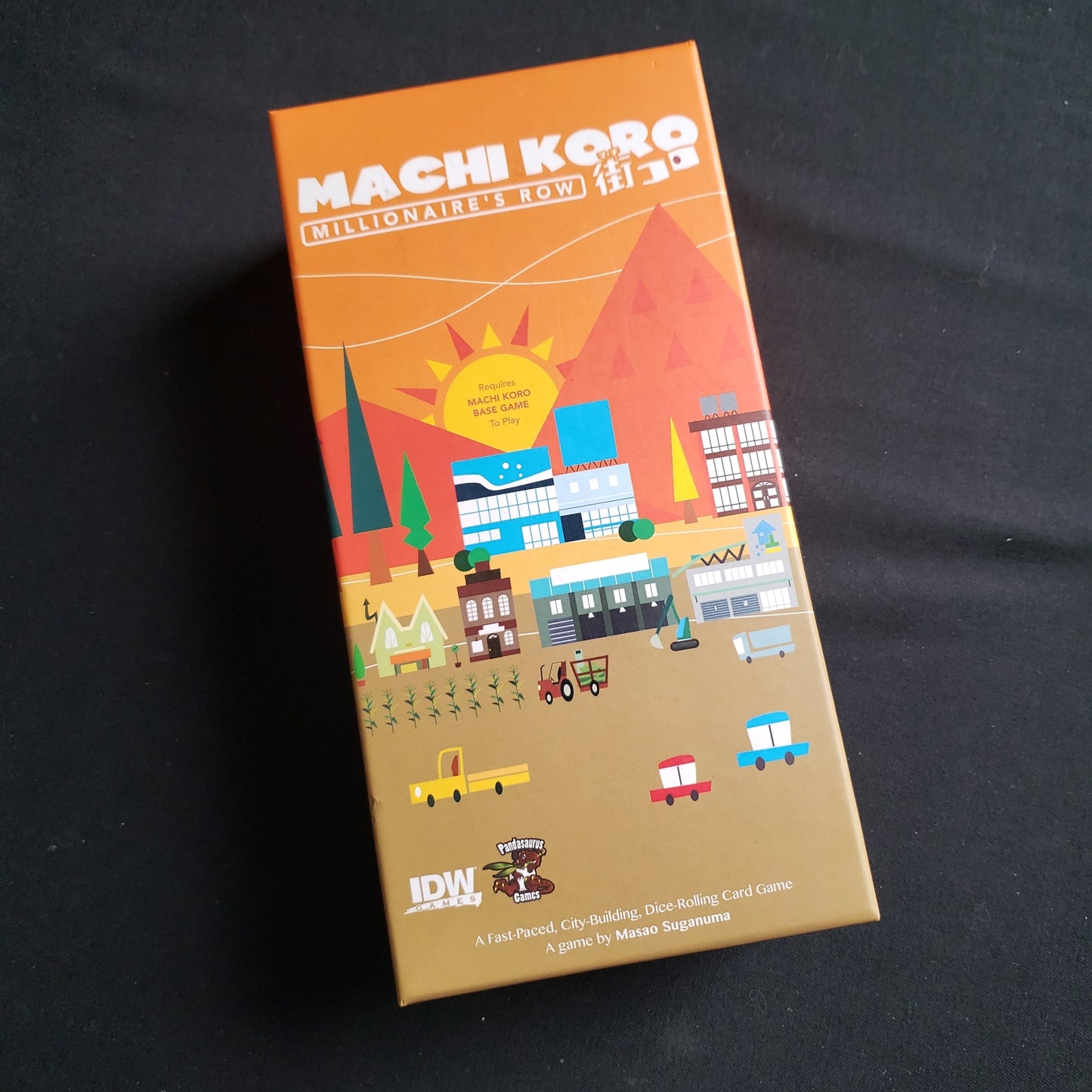 Image shows the front of the box for the Millionaire's Row Expansion for the Machi Koro board game