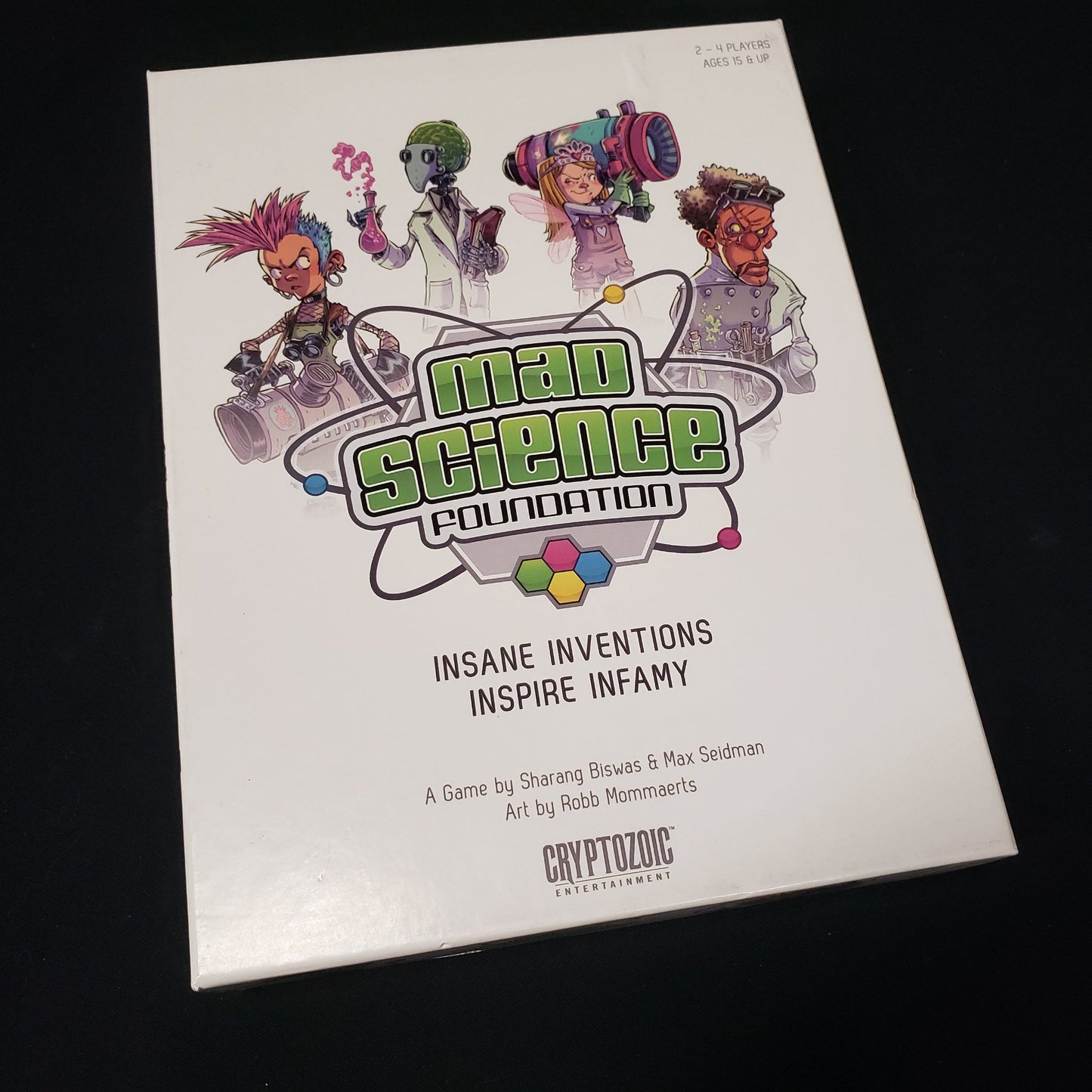 Image shows the front cover of the box of the Mad Science Foundation board game