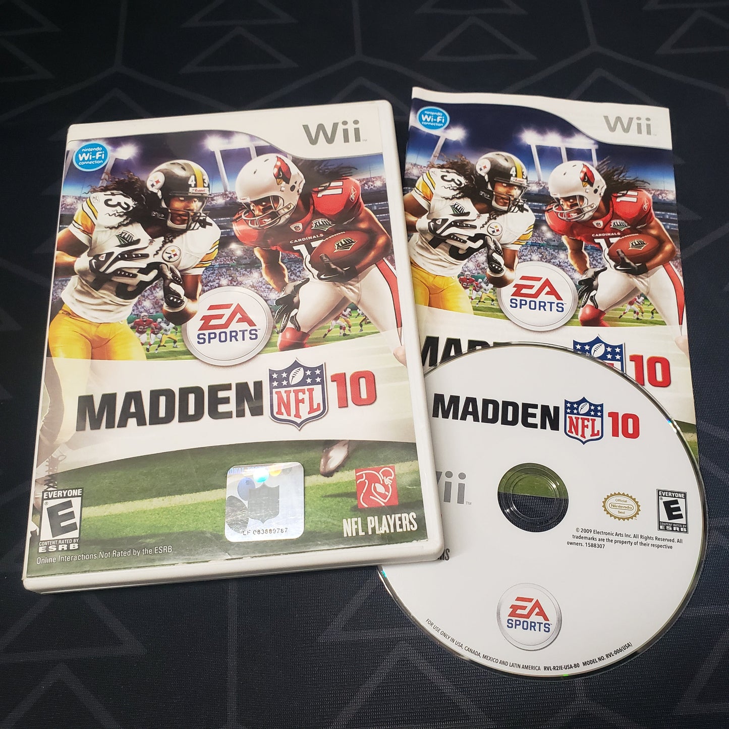 Image shows the case, manual & disc for the video game Madden NFL 10 for Nintendo Wii