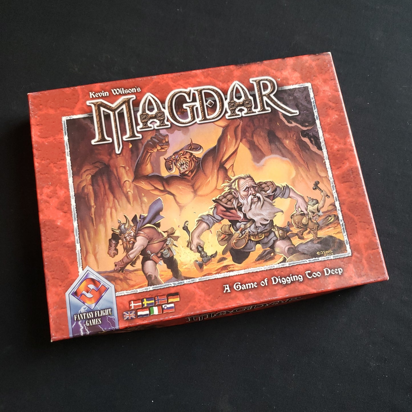 Image shows the front cover of the box of the Magdar board game