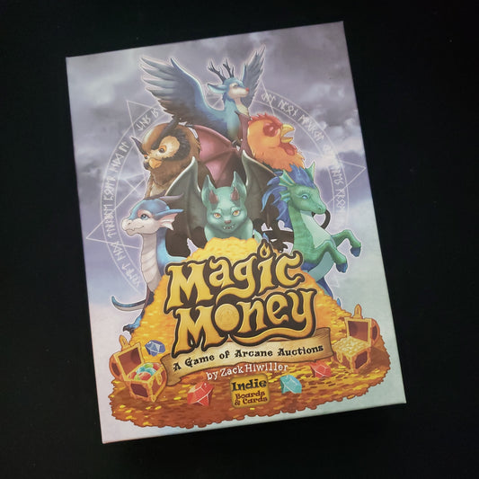 Image shows the front cover of the box of the Magic Money card game
