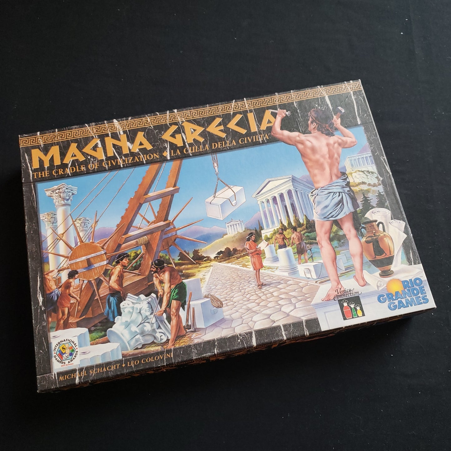 Image shows the front cover of the box of the Magna Grecia board game