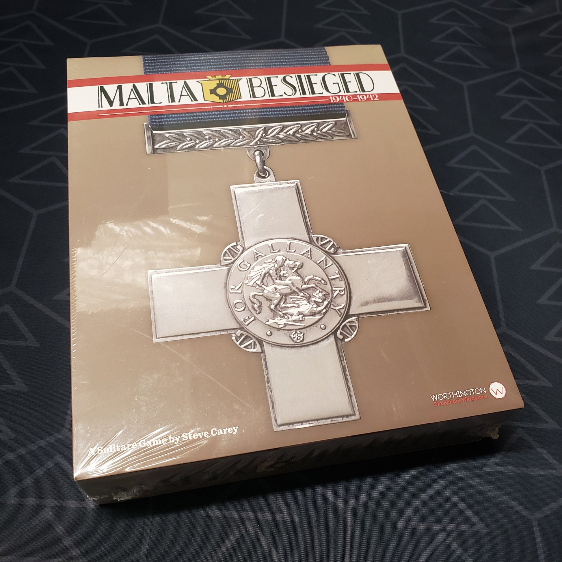 Image shows the front cover of the box for the Malta Besieged: 1940-1942 board game