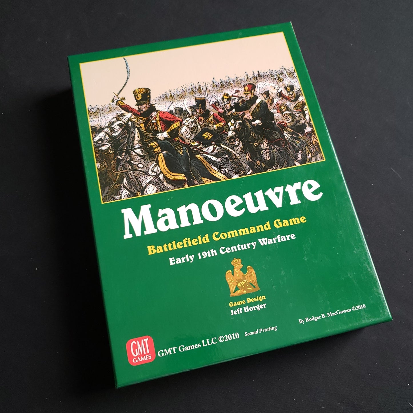 Image shows the front cover of the box of the Manoeuvre board game