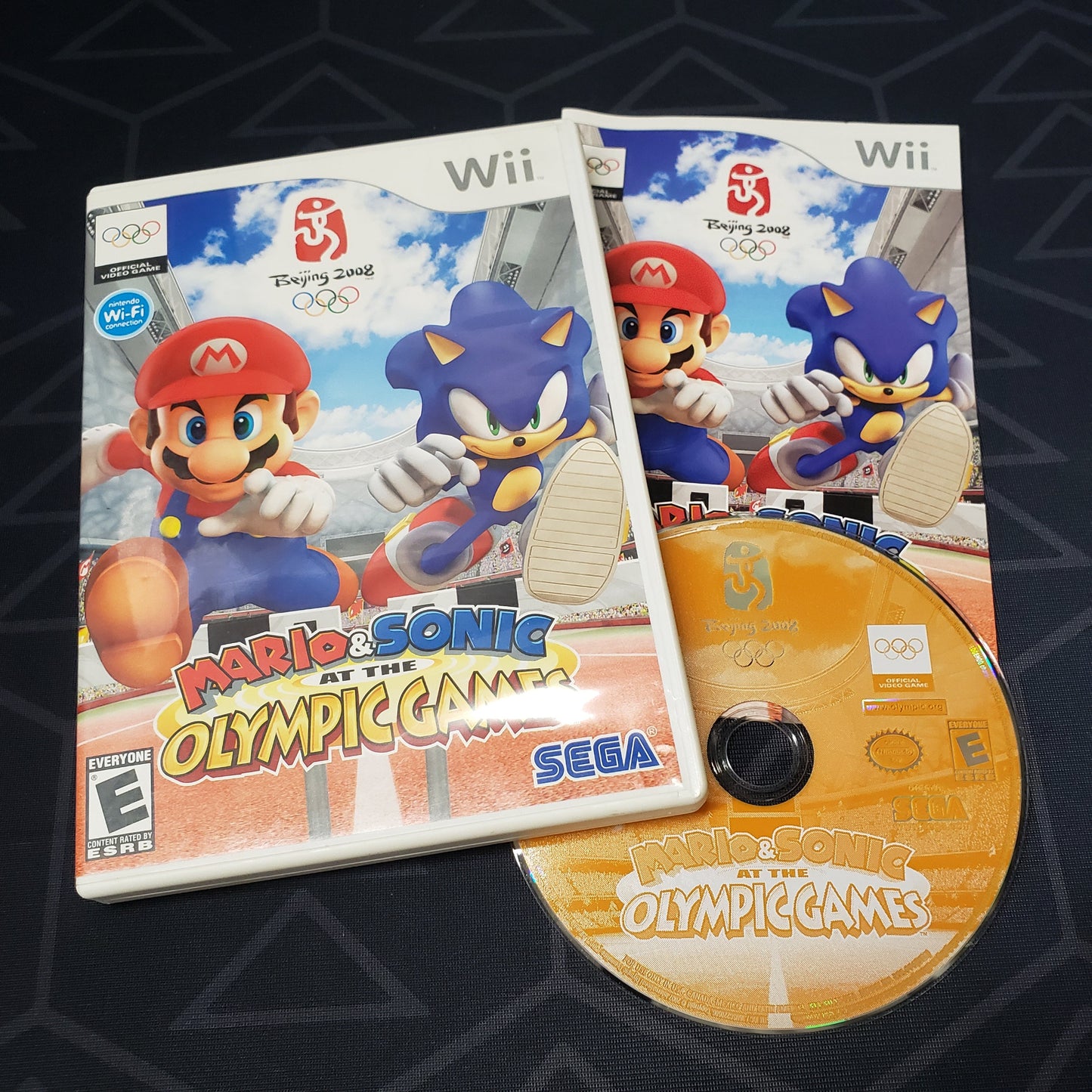 Image shows the case, manual & disc for the video game Mario & Sonic at the Olympic Games for Nintendo Wii