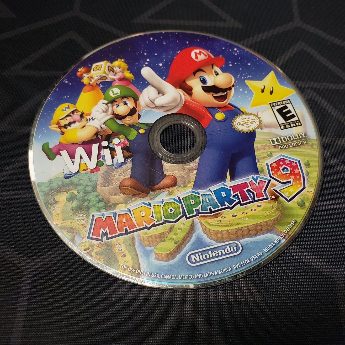 Image shows the game disc for the video game Mario Party 9 for Nintendo Wii