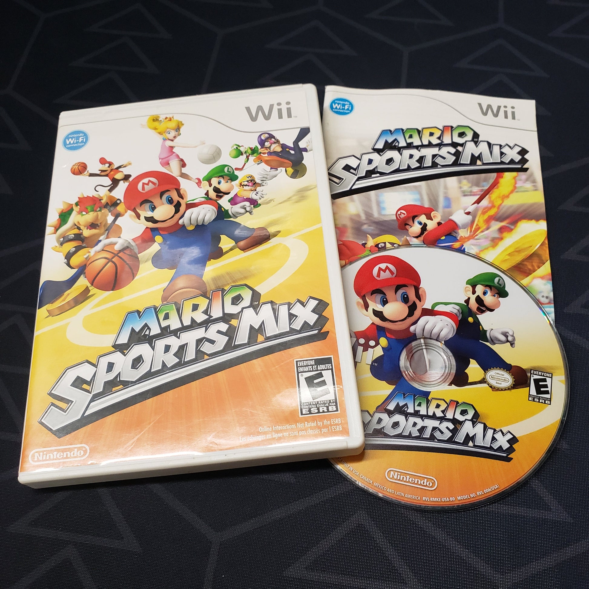 Image shows the case, manual & disc for the video game Mario Sports Mix for Nintendo Wii