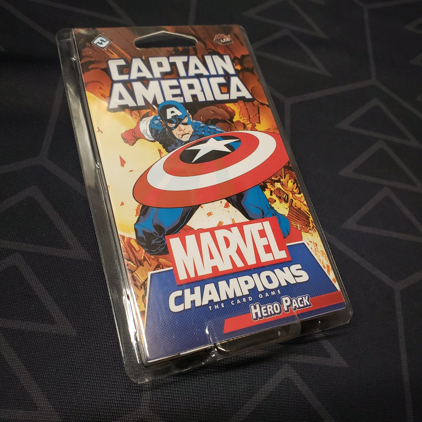 Image shows the front of the package for the Captain America Hero Pack for the Marvel Champions card game
