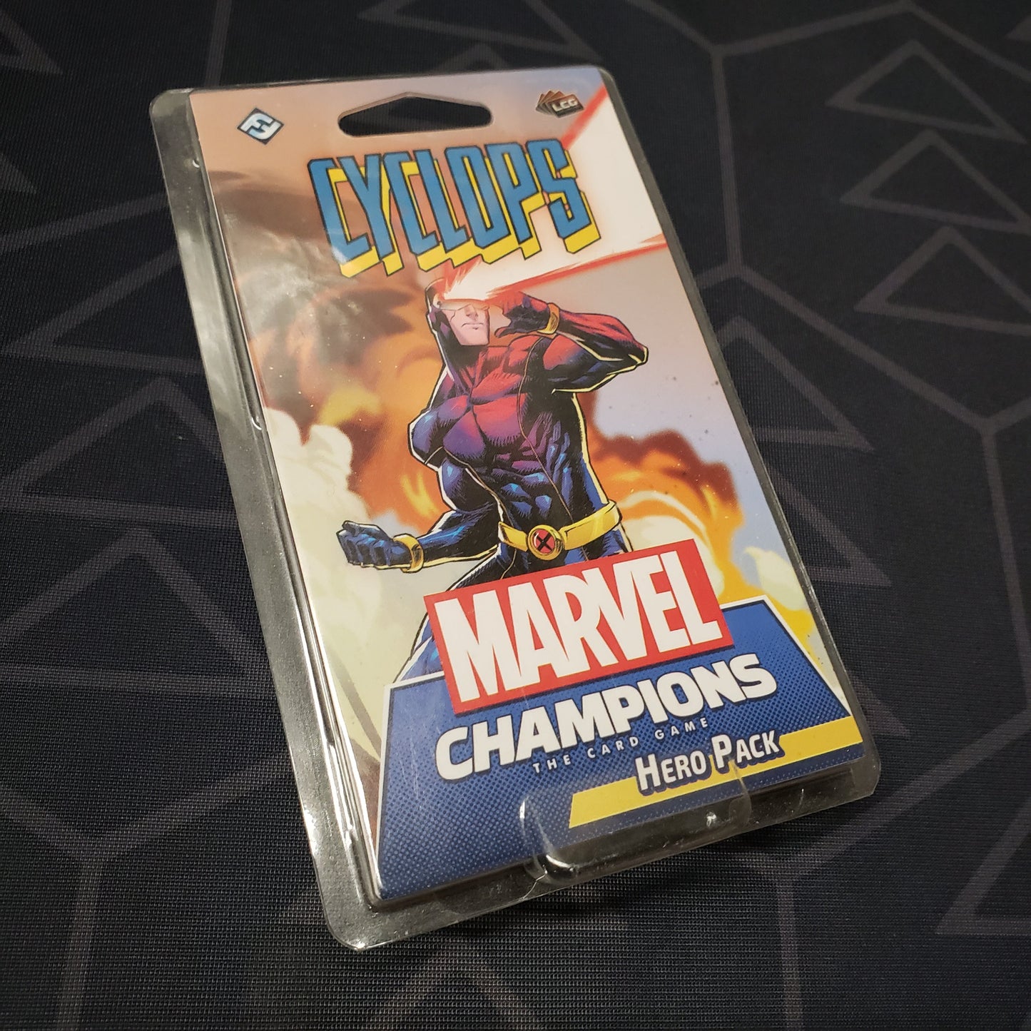 Image shows the front of the package for the Cyclops Hero Pack for the Marvel Champions card game