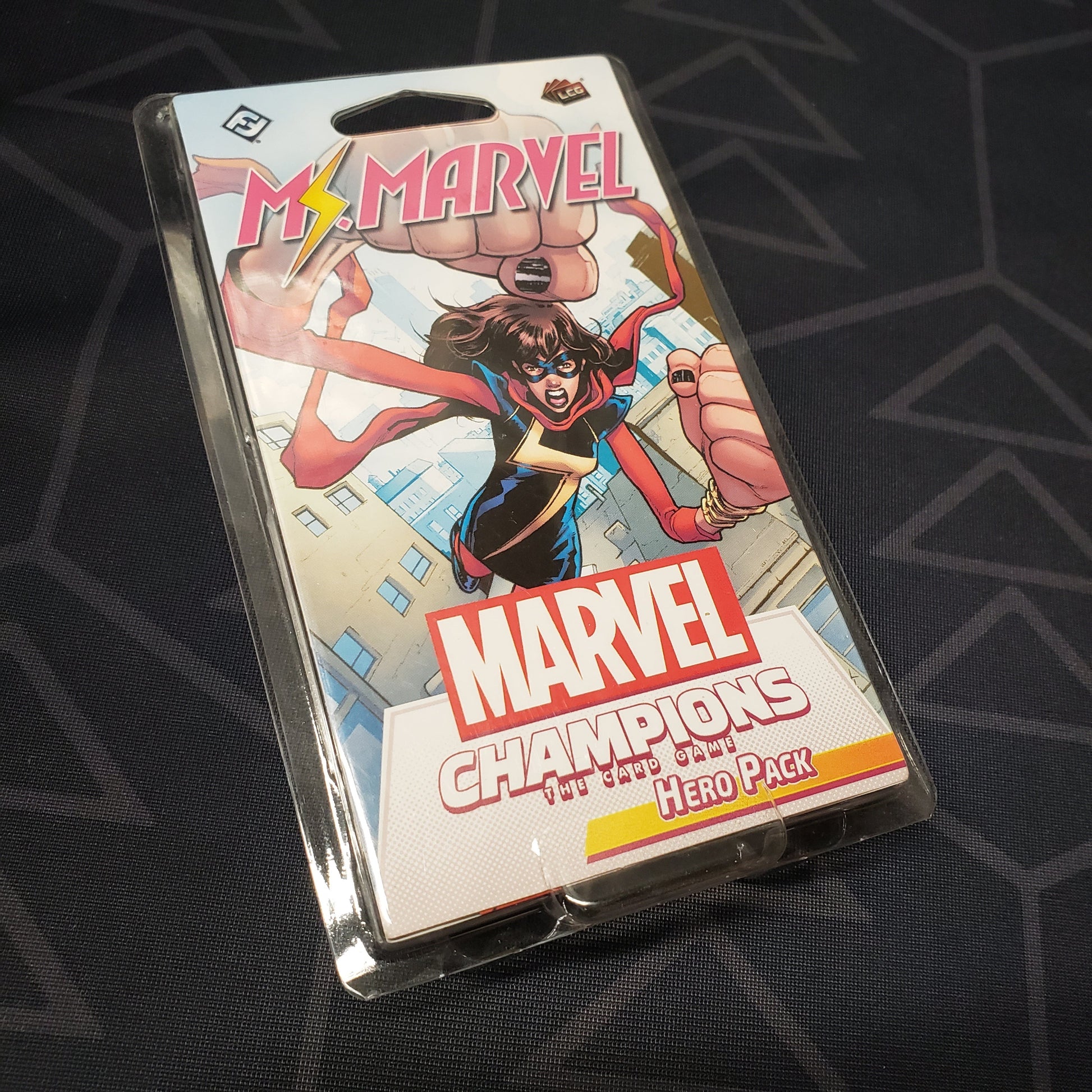 Image shows the front of the package for the Ms. Marvel Hero Pack for the Marvel Champions card game